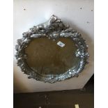 A silver painted gesso mirror