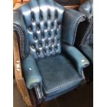 A Chesterfield blue leather wing back armchair