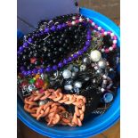 A tub of vintage and modern costume jewellery