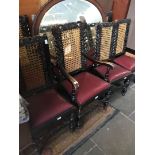 A set of six bergere backed carved oak chairs