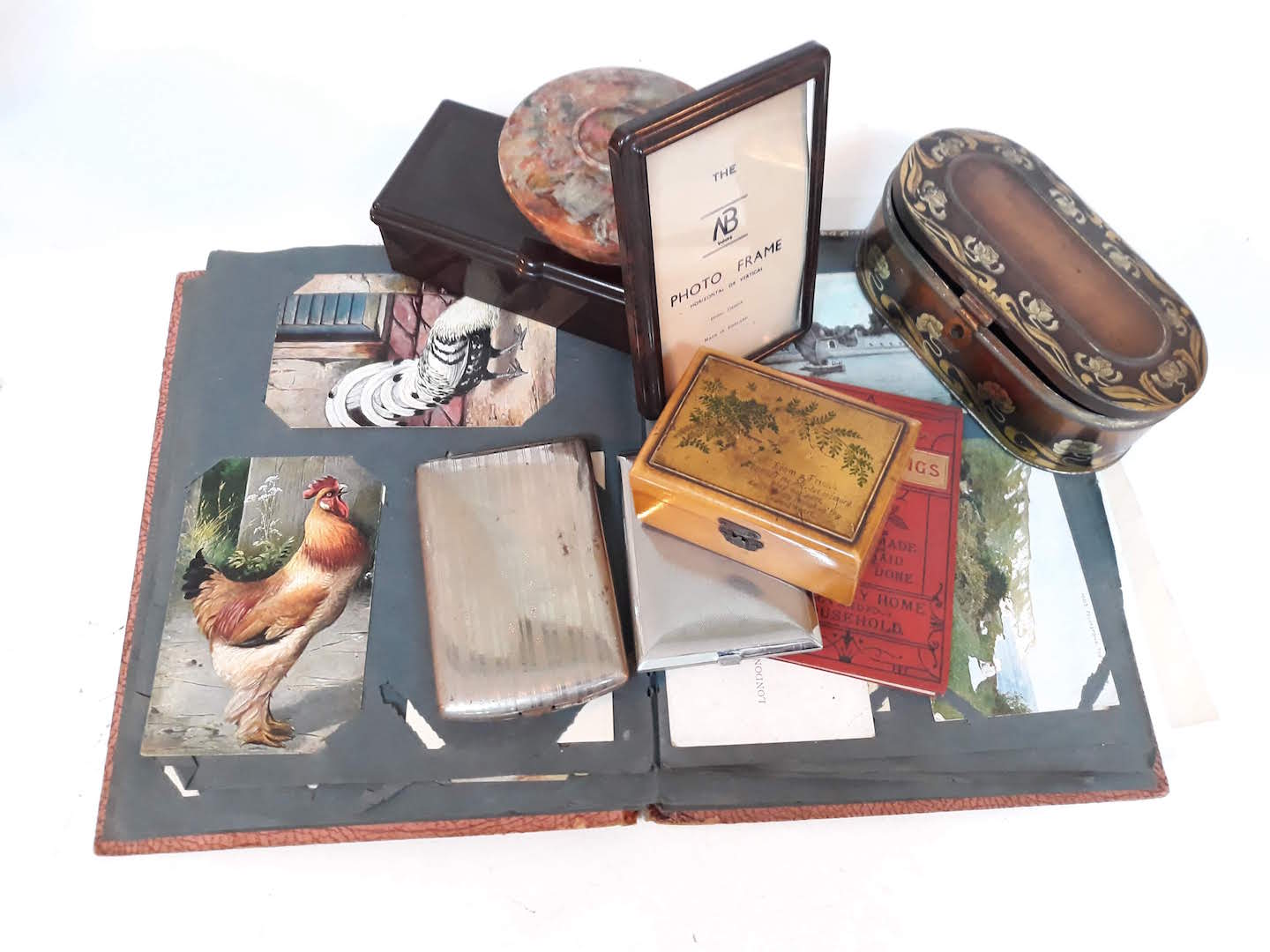 A mixed lot to include bakelite, postcards, a Mauchline ware box etc.