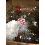 A box of glassware to include jars