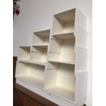 Painted white stepped shelves.