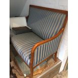 A striped upholstered two seater settee.