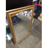 A large gilt framed mirror