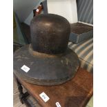 A vintage wooden hat block.