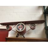 A shelf/clock in the form of a plane