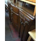 A 1930s oak sideboard.