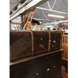 A vintage wooden bound travel trunk