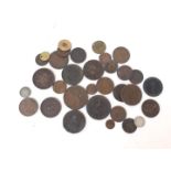 A tin of mainly copper coins and tokens.