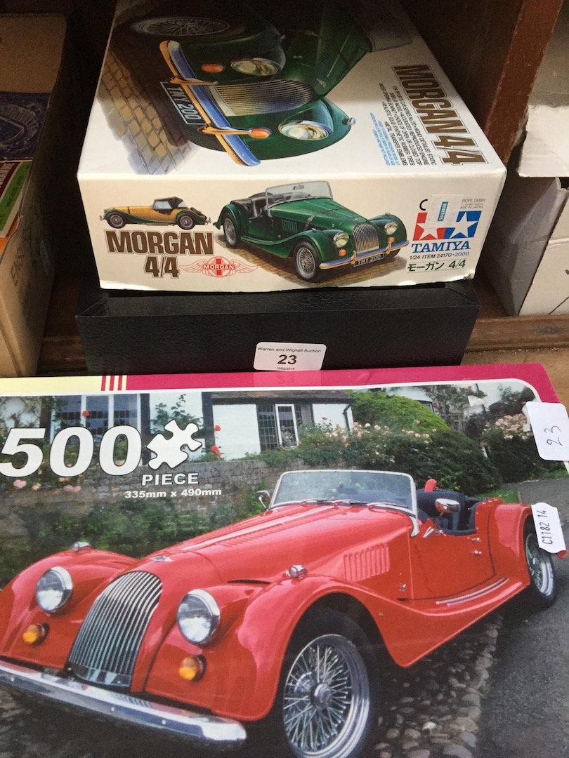 2 Morgan car jigsaws and a watch display case