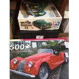 2 Morgan car jigsaws and a watch display case