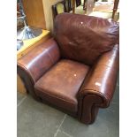 A brown leather arm chair