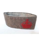 A WWI military armband, the interior stamped 'Issued Under Authority of Army Council'.