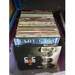 A box of LPs and 12" singles and a U2 book