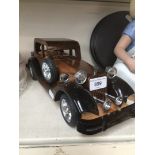 A wooden model vintage car
