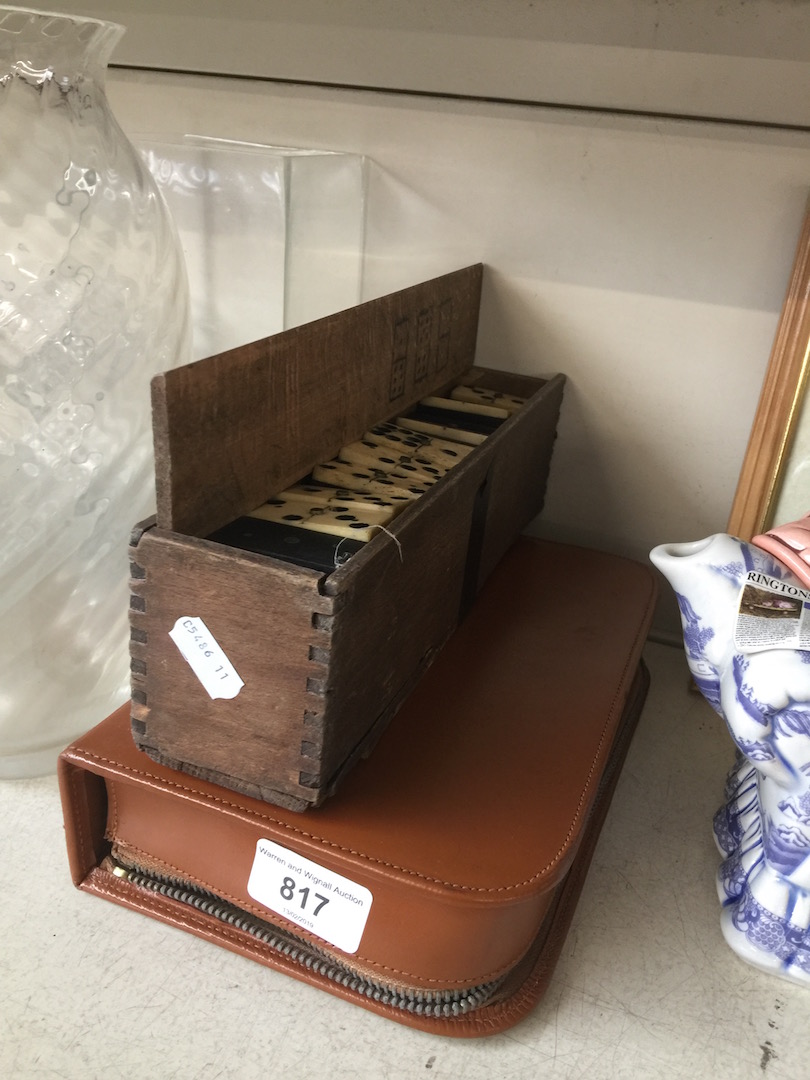 A boxes set of bone and ebony dominoes and a gent's travel set.