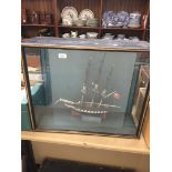 A model ship in a glass case