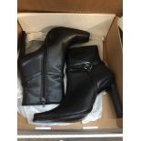 A pair of ladies boots size 3