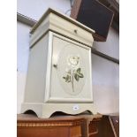 A painted bedside cabinet