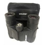 A pair of Helios pocket binoculars with soft case.