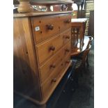 A pine chest of drawers.