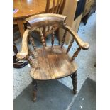 A stained beech captain's chair