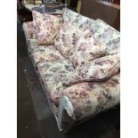 A Chesterfield show wood settee with floral upholstery