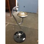 An Art Deco chrome smoker's stand on black base