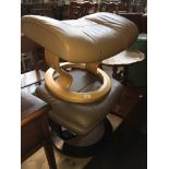 Stressless tan leather foot stool and another.