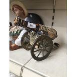 Pottery and brass cannon decanter
