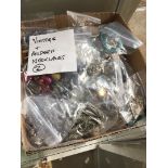 A box of vintage and modern necklaces