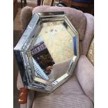 A contemporary Art Deco style octagonal mirror