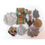 A mixed lot of medals and badges including a WWI Victory medal awarded to 1127 CPL W PATE RA, a