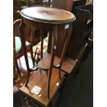 A mahogany round occasional table or plant stand