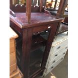 A glazed mahogany cabinet