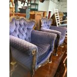 A pair of French style armchairs with carved wood frames