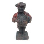 A cast iron figure depicting John Bull, height 14cm.