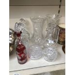 Three glass decanters and four other glass items