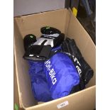 A box of boxing gloves, motorcycle gloves, bike items, etc