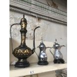 Three eastern metal tea pots