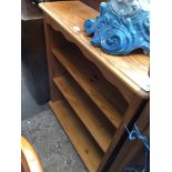 An open pine bookcase