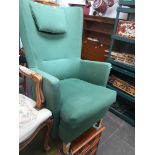 An Ikea high back armchair in green upholstery