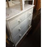 A Victorian white painted chest of drawers.