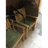 A wooden garden table and four chairs