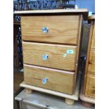 A pine bedside cabinet