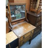 An oak chest of drawers with mirror