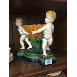 Modern majolica style bowl with cherubs