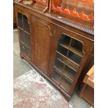 A reproduction mahogany display cabinet