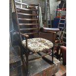 A retro ladder back rocking chair